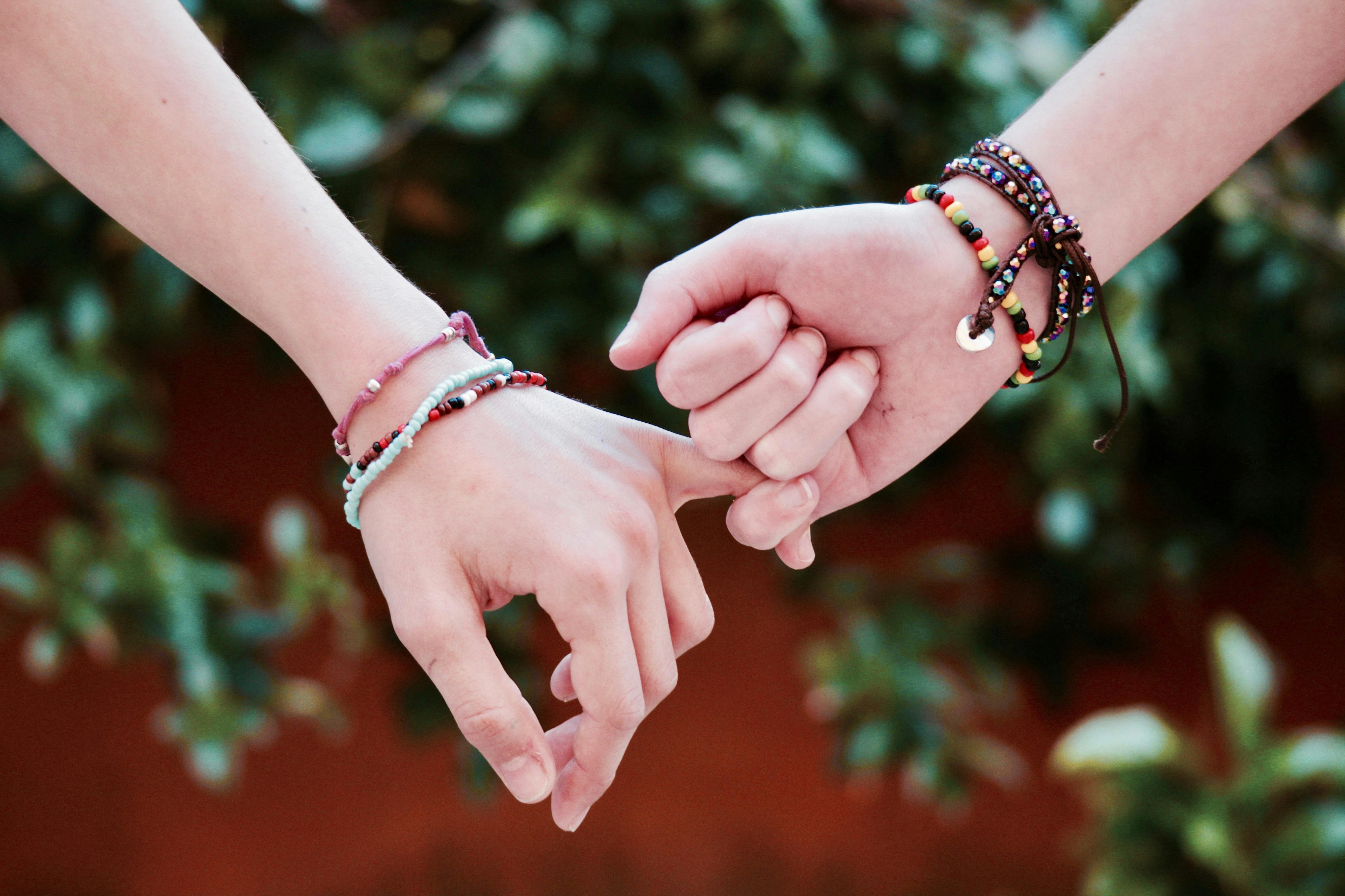 Two Person Holding Hands Free Stock Photo