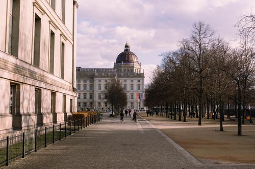 Free Berlin street view showcasing classic architecture and the Humboldt Forum under a clear sky. Stock Photo