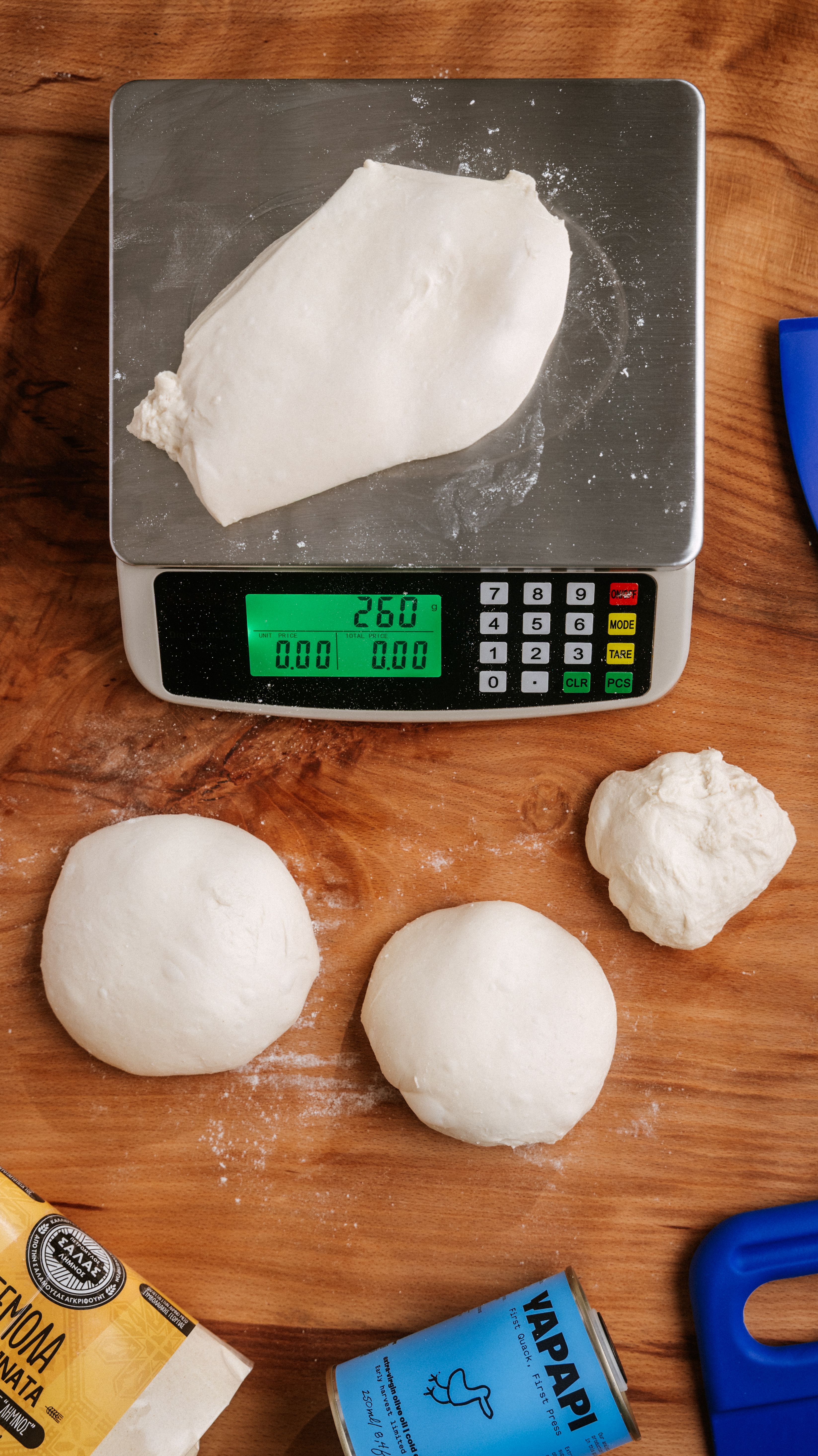 Digital scale measuring flour for pizza dough with two portions`