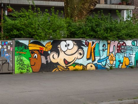 Vibrant graffiti mural depicting cartoon characters on a wall in Hamburg.