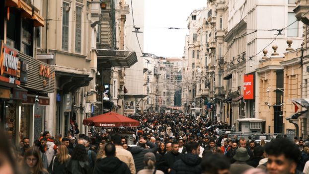 Lively crowd on Istiklal Avenue, Istanbul. Captivates vibrant urban life.