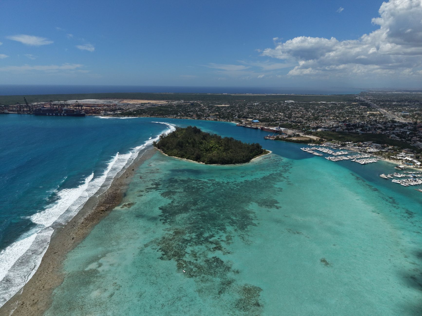 Stunning aerial shot of a turquoise lagoon and coast in Santo Domingo, Dominican Republic.
