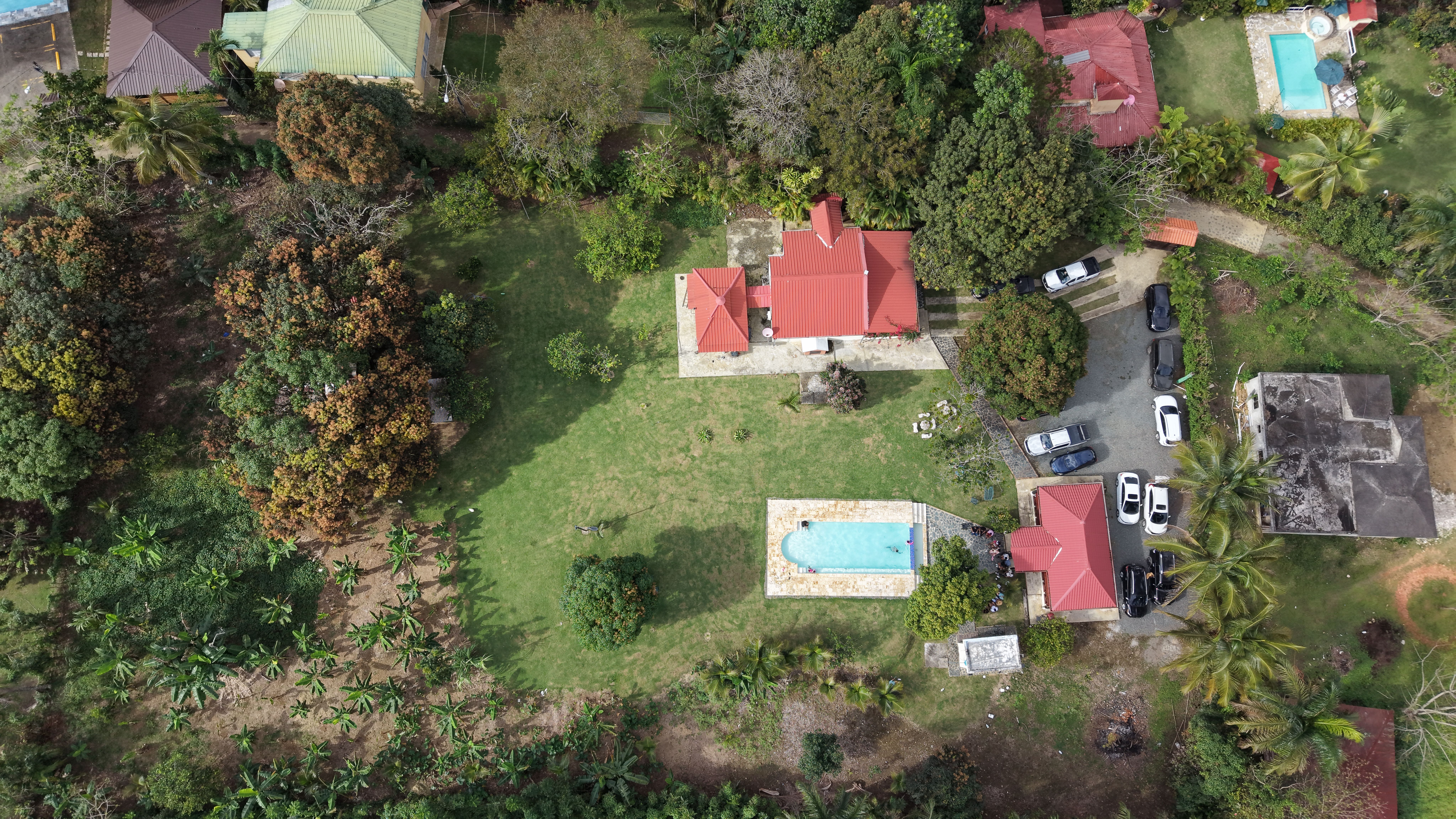 Aerial View of Tropical Property with Red Roofs and Pools · Free Stock ...