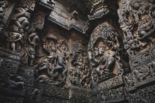 Detailed carvings showcasing ancient stone sculptures in a historic temple setting.
