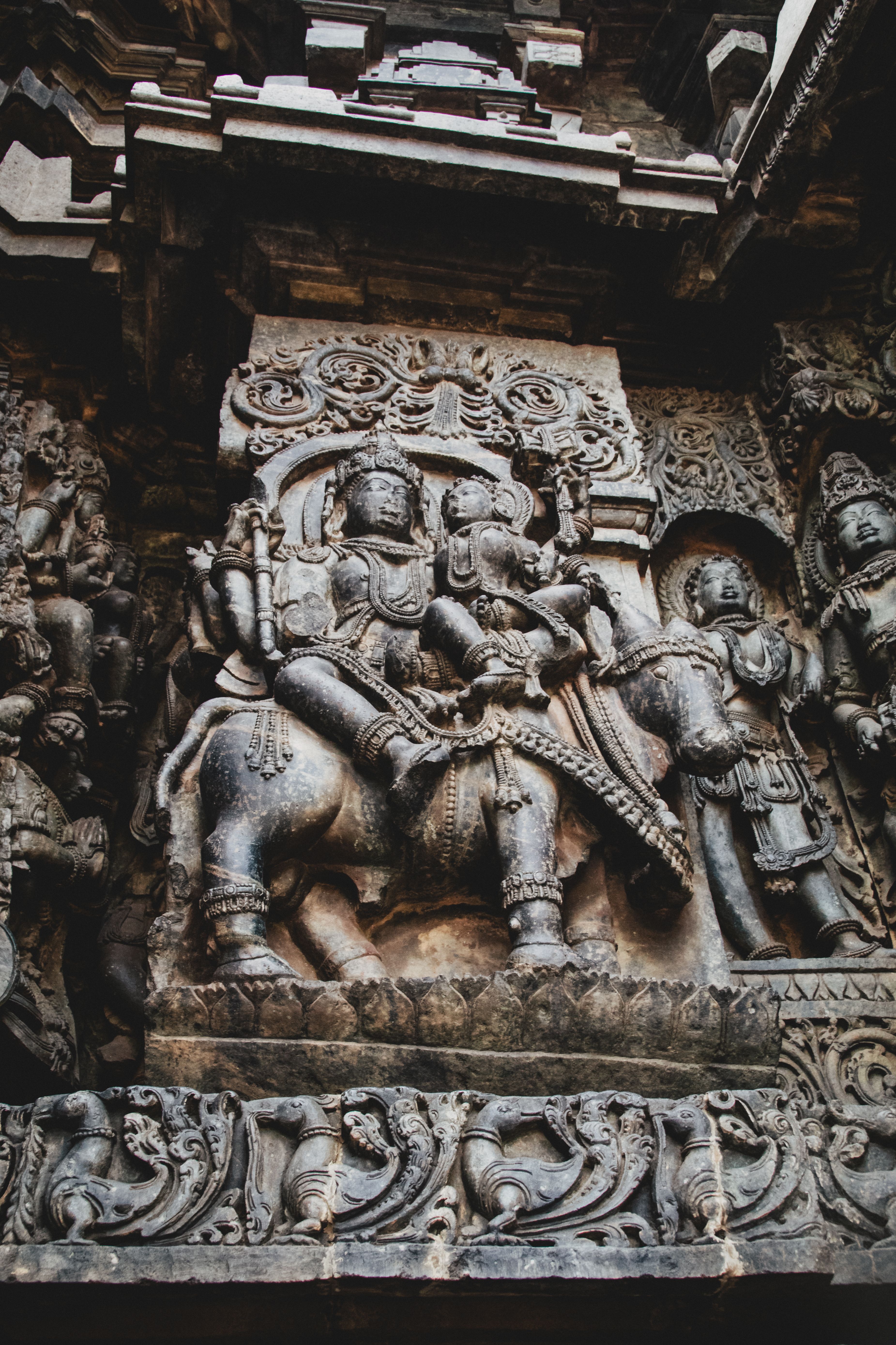 Intricate Stone Carvings on Ancient Temple Wall · Free Stock Photo