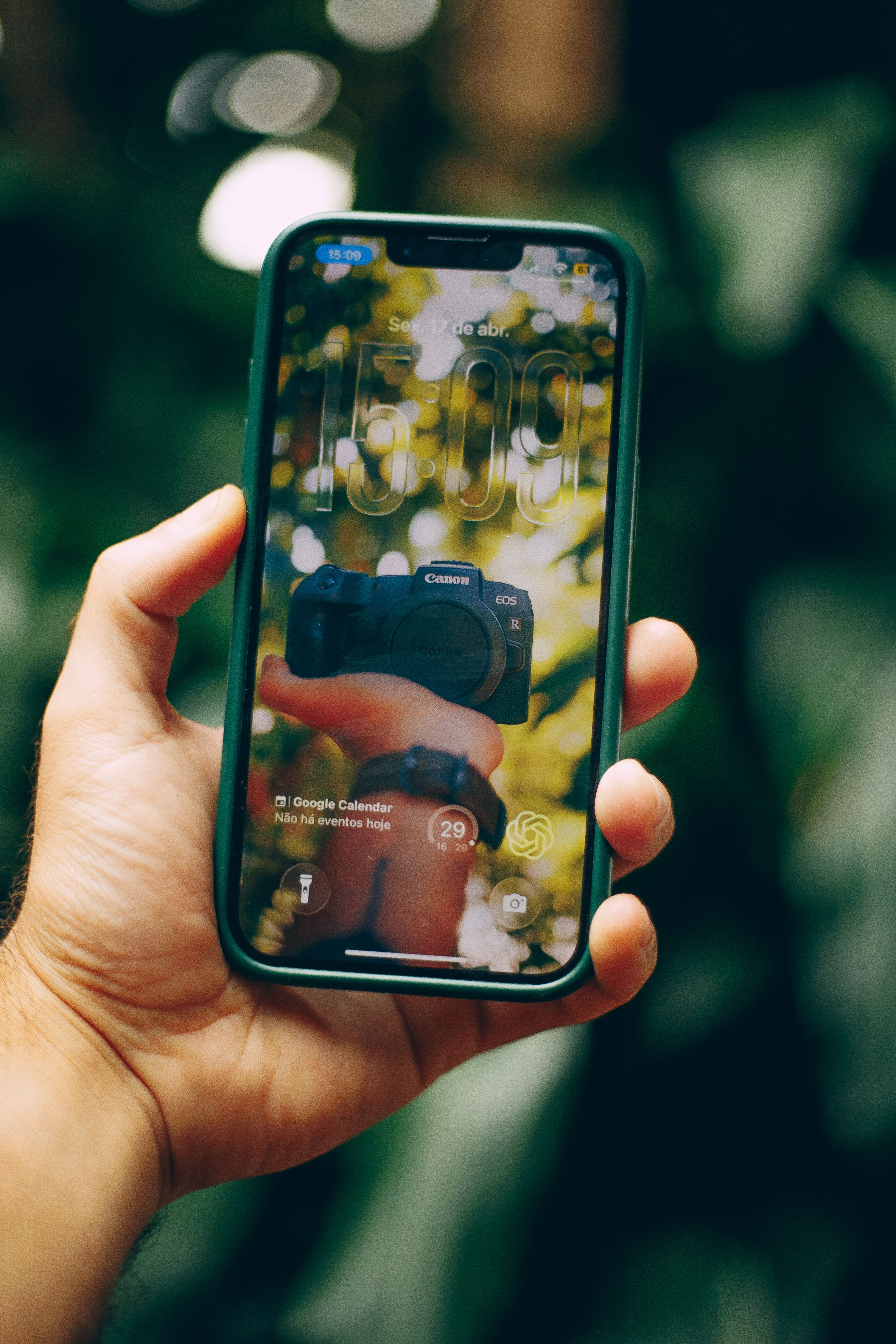 Smartphone Reflecting Nature in Screen Reflection · Free Stock Photo