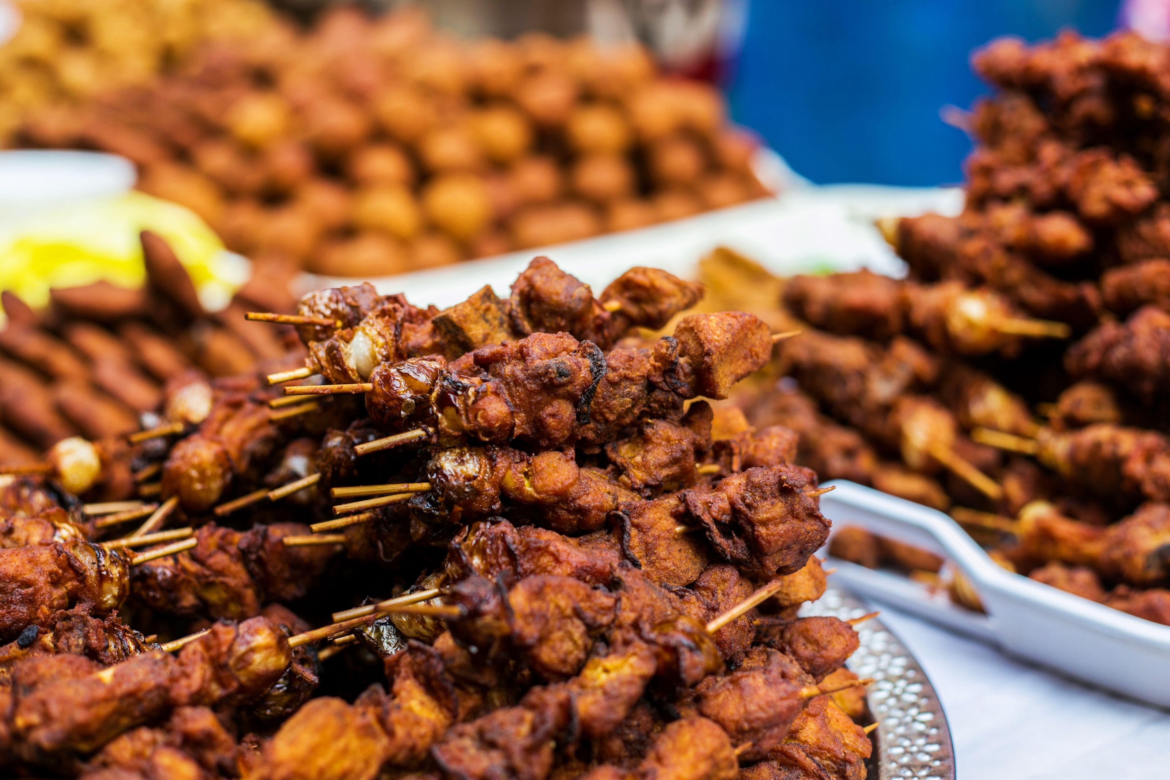 Colorful food stalls at Victory Bible Church Aflao, with Ghanaian and Togolese dishes displayed side by side