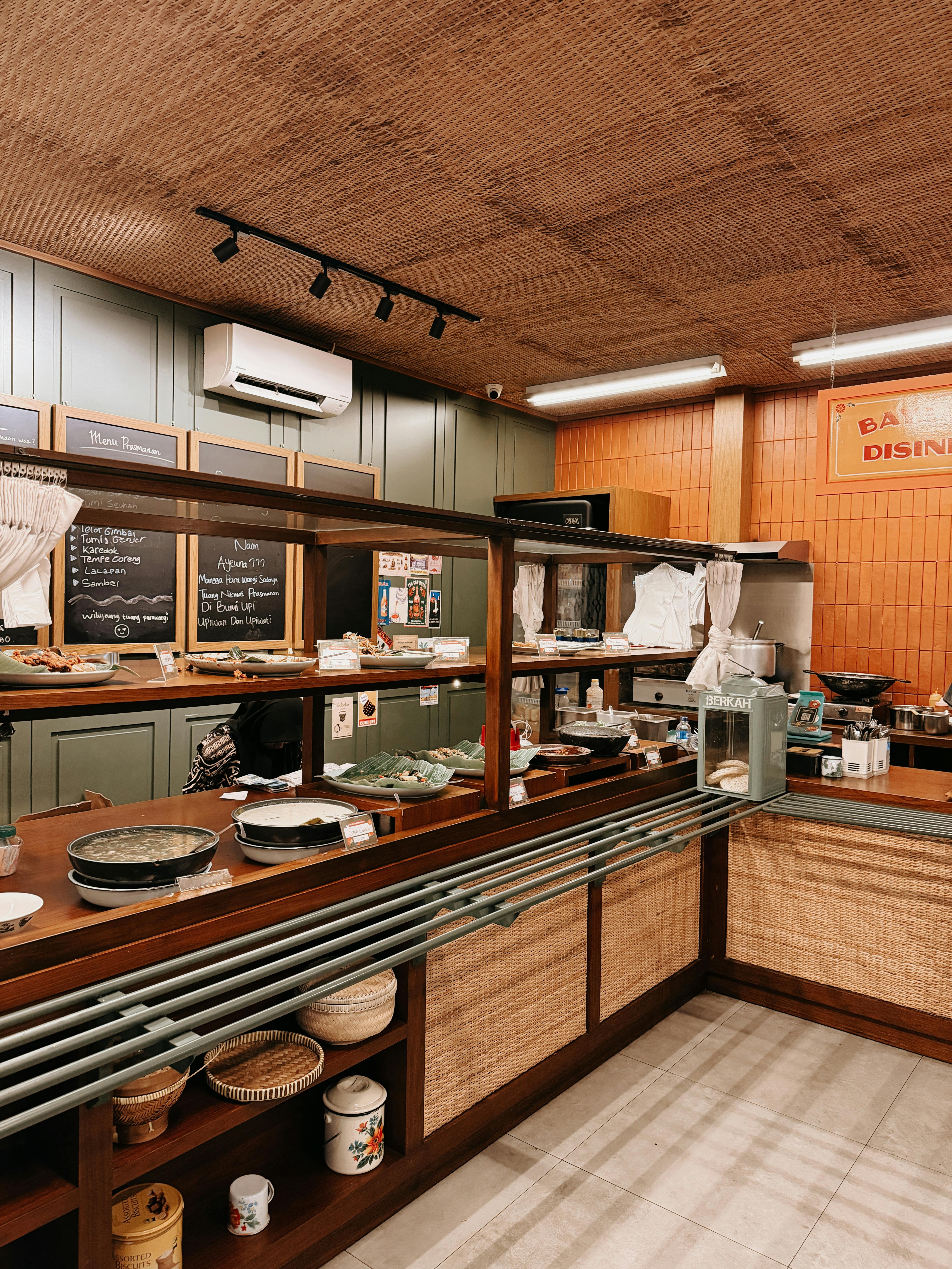 Warm and inviting view of a traditional Indonesian restaurant interior in Garut.