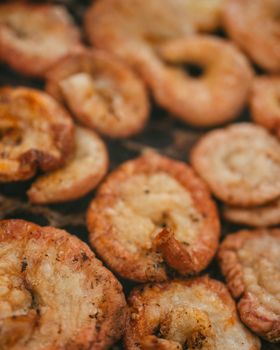 Close-up of crispy chicharrón frying, showcasing traditional Argentinean cuisine in Uribelarrea.