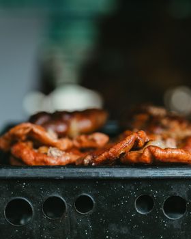 Close-up of mouth-watering grilled meat sizzling on a barbecue in Uribelarrea, Argentina.