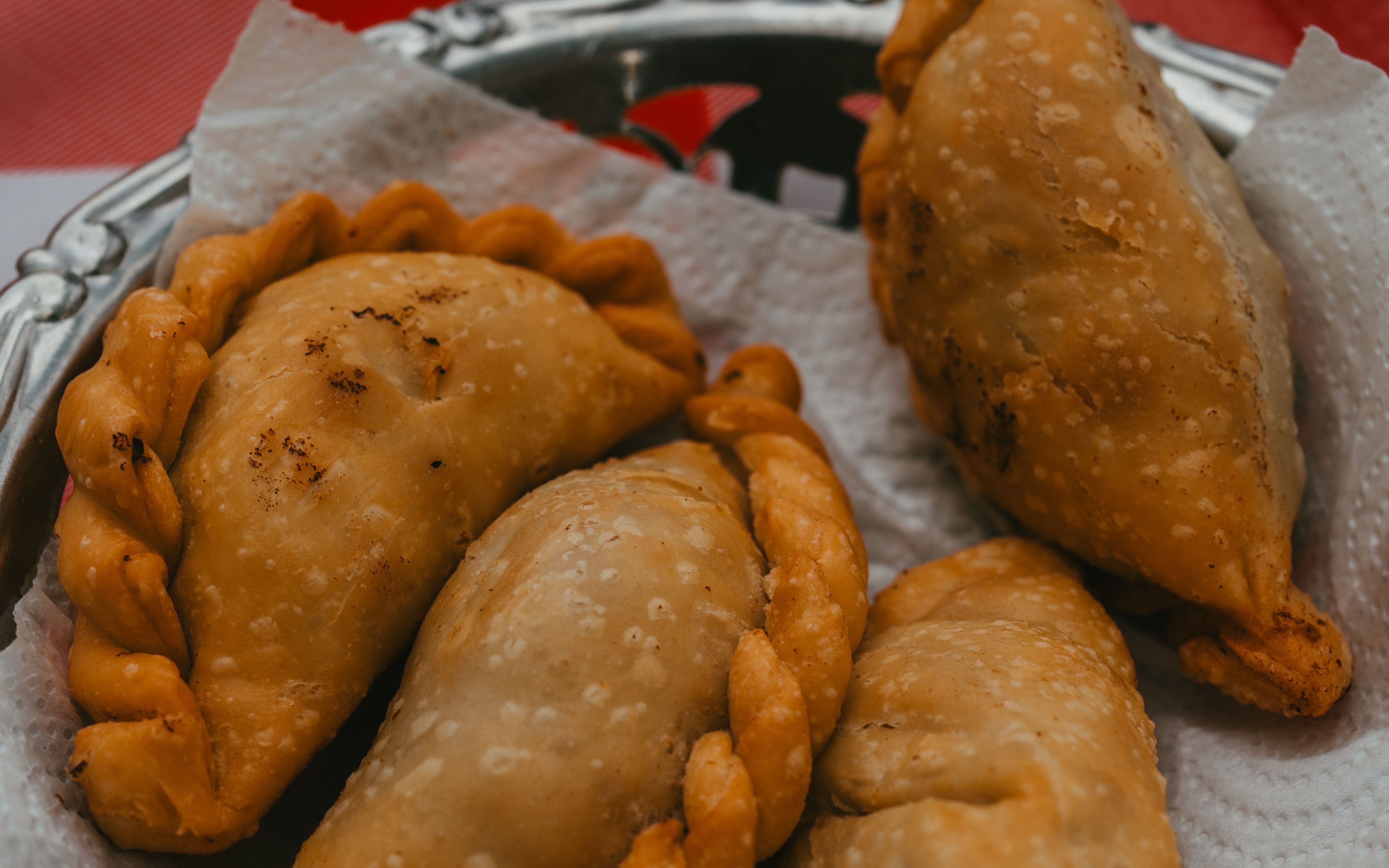 Close-up of traditional Argentine empanadas served on a plate, showcasing a classic Uribelarrea dish.