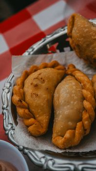 Close-up of delicious homemade empanadas in Uribelarrea, Argentina, offering a taste of local cuisine.