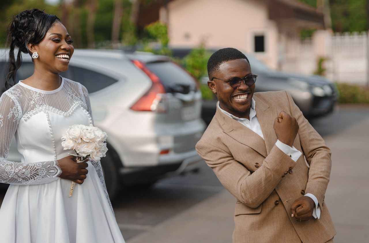 a happy bride and groom celebrating outdoors with smiles and laughter