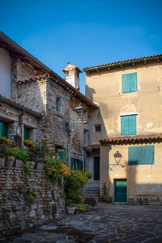Picturesque Grado street corner showcasing rustic Italian architecture and vibrant colors.