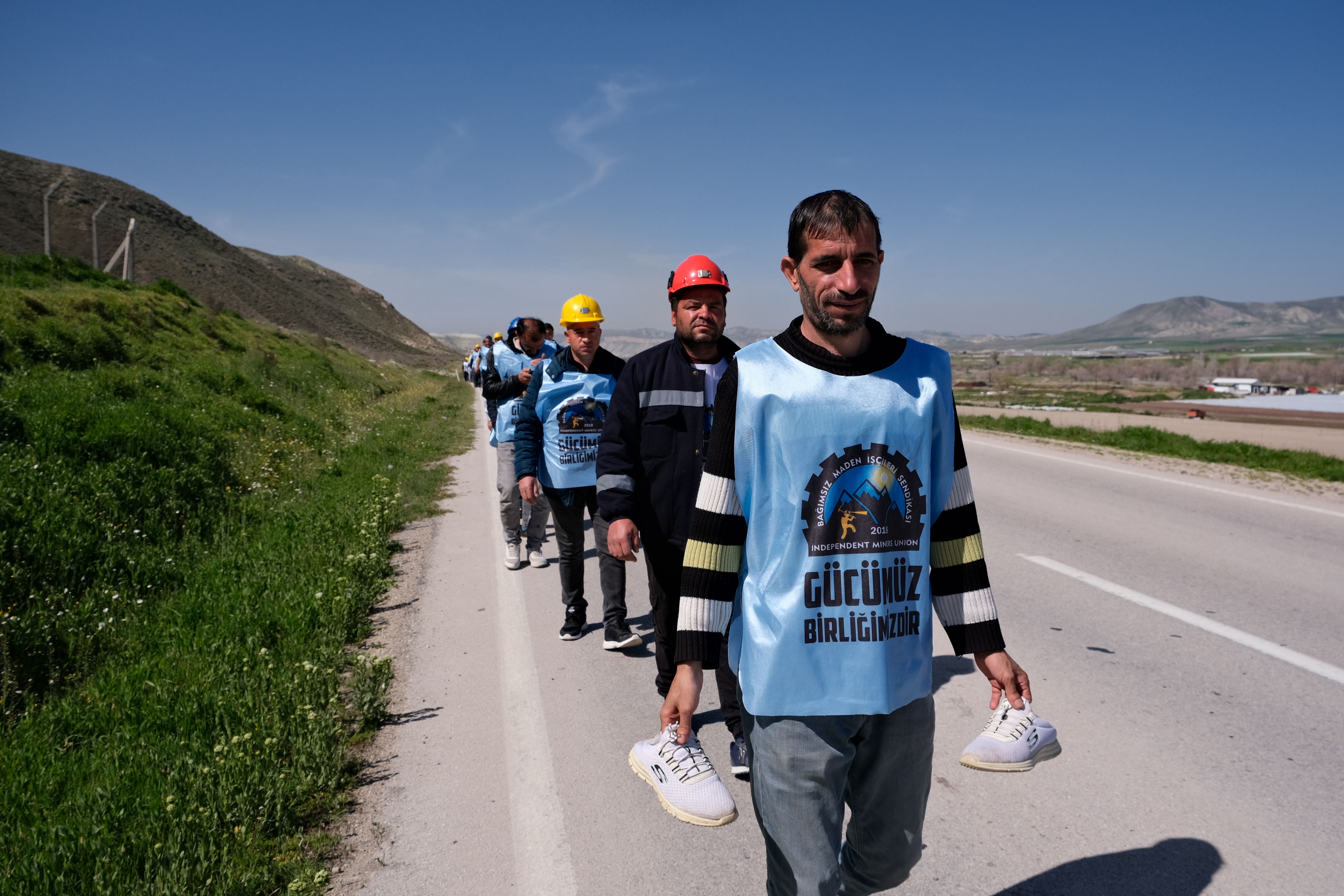 Men Marching Along Road in Protest · Free Stock Photo