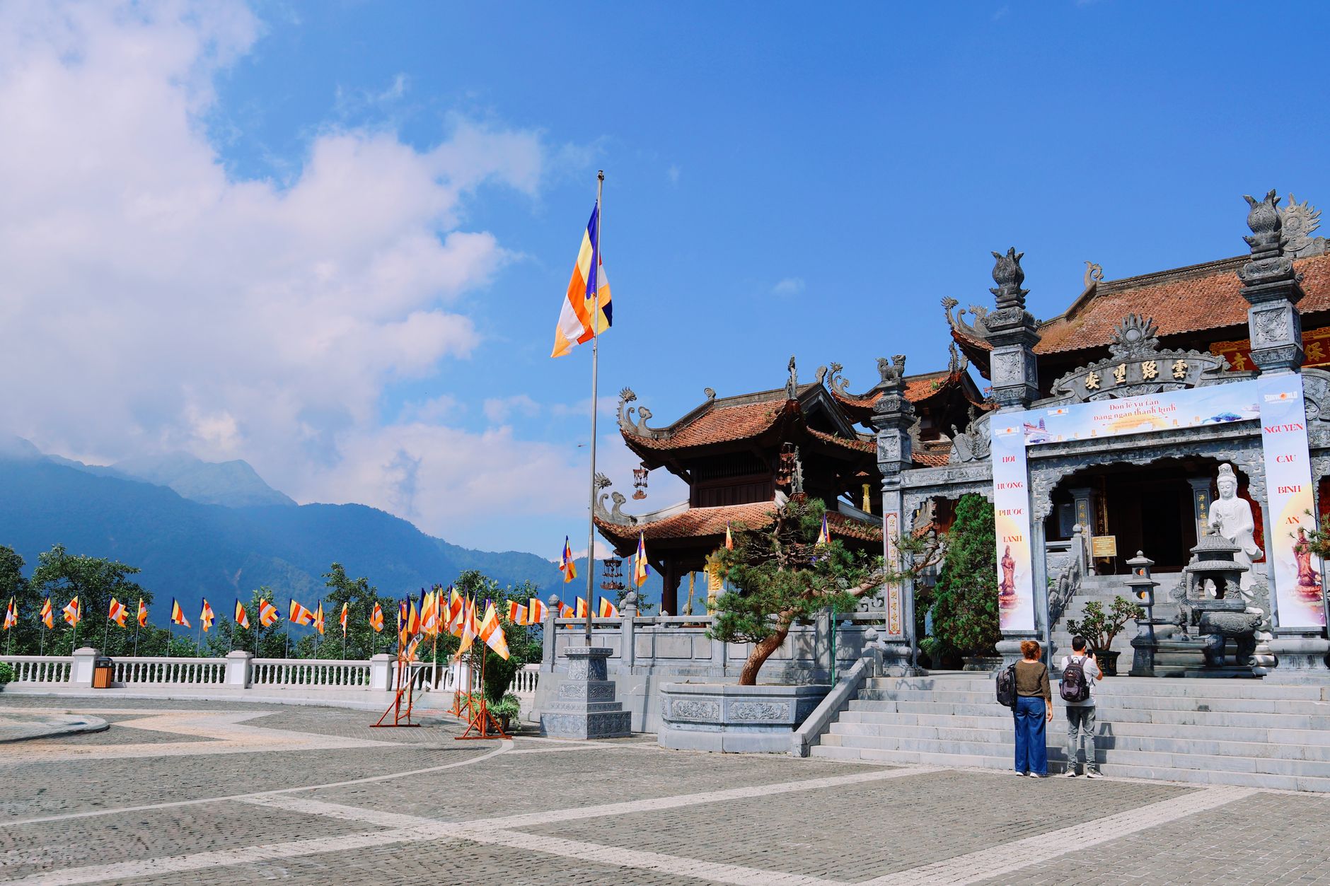 Explore the stunning Buddhist temple architecture in Lào Cai, Vietnam, set against majestic mountain views.
