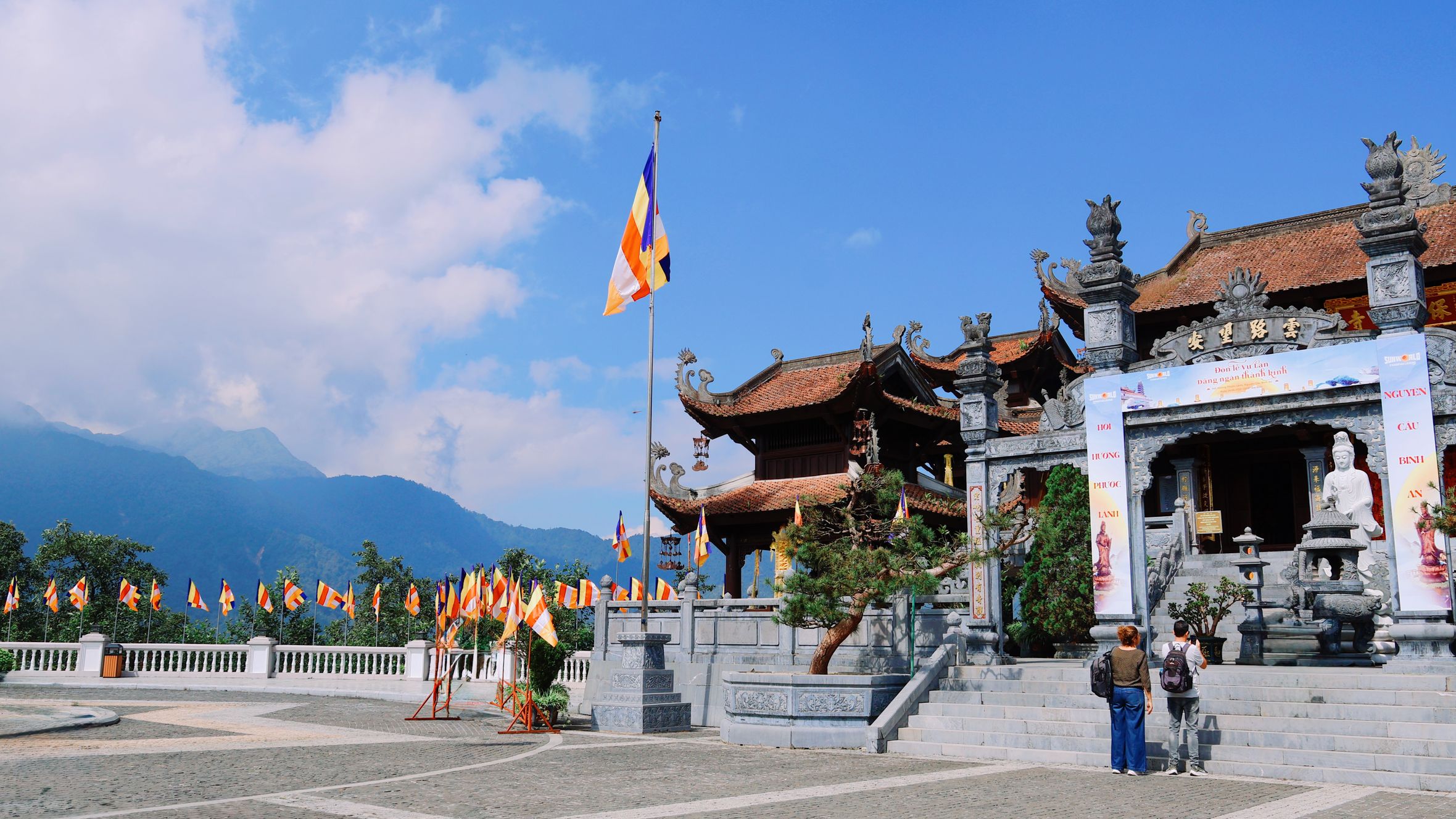 Explore the stunning Buddhist temple architecture in Lào Cai, Vietnam, set against majestic mountain views.