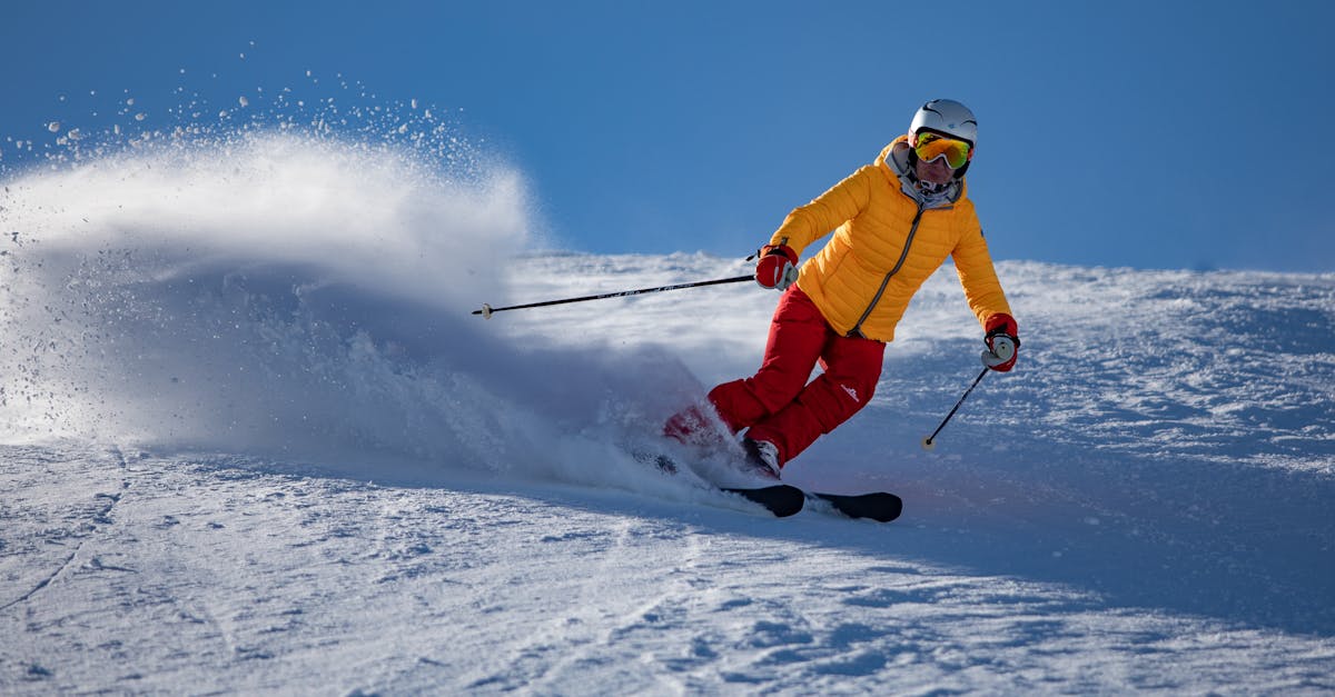 Person in Yellow Jacket and Red Riding on Snow Ski · Free Stock Photo
