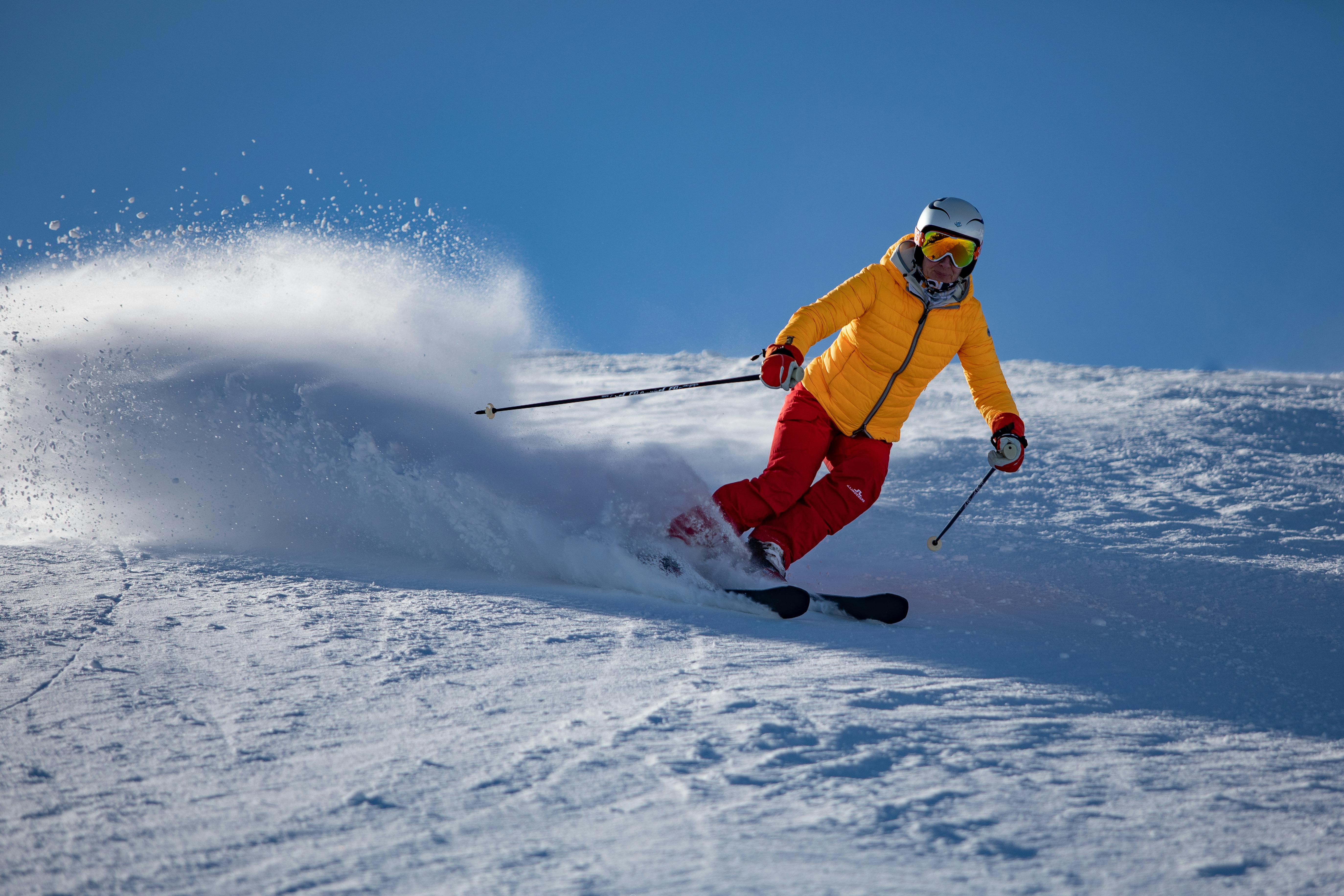 Man Doing Ice Skiing on Snow Field in Shallow Focus Photography · Free ...