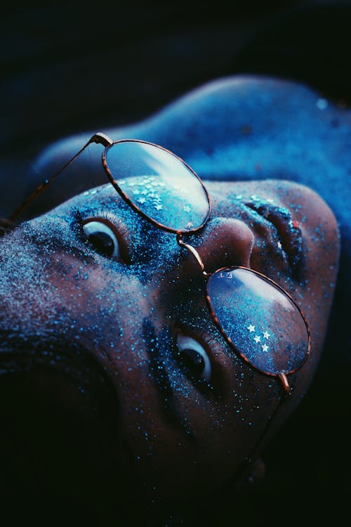 Woman With Glitters On Her Face