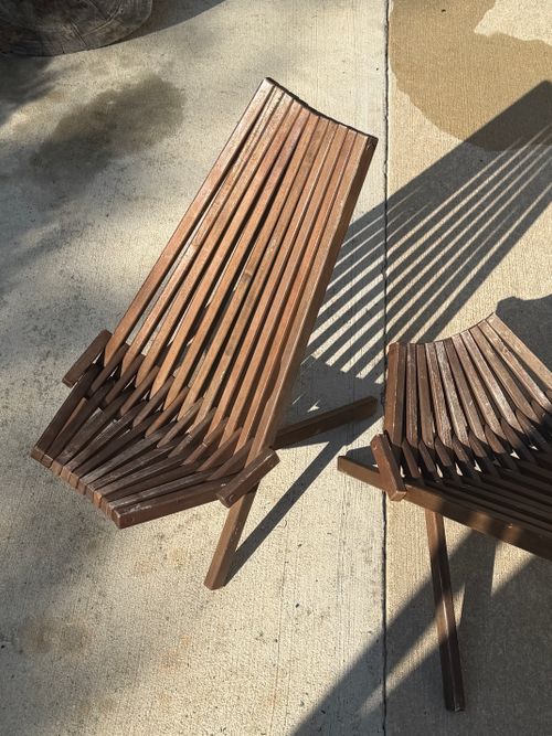 Free Artistic wooden benches casting intriguing shadows on a sunny day outdoors. Stock Photo