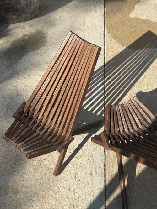 Free Modern wooden benches creating distinctive shadow patterns outdoors on a sunny day. Stock Photo
