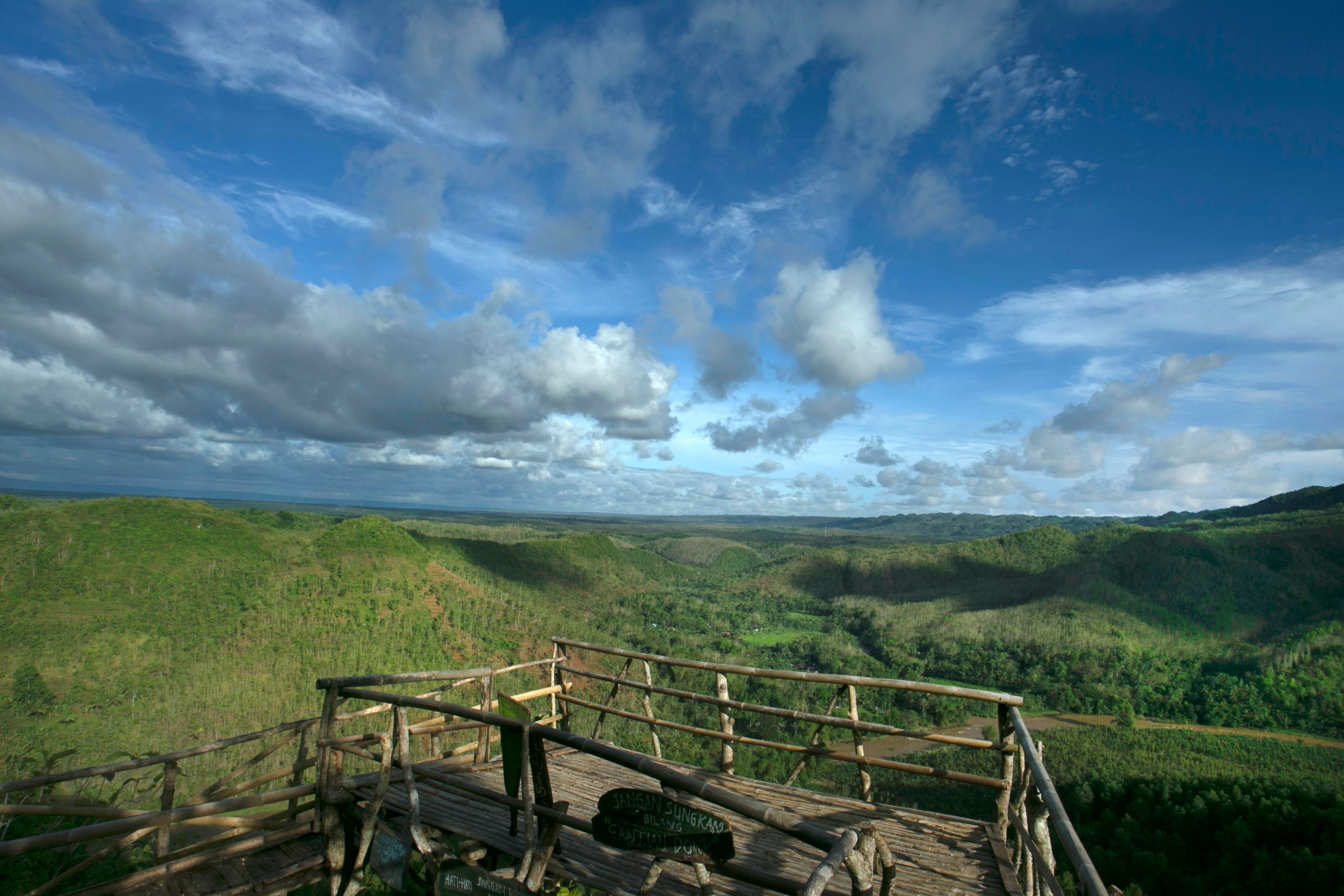 Scenic Viewpoint Over Green Hills Landscape · Free Stock Photo