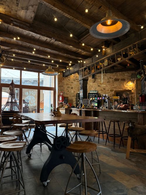 Free A warm and inviting rustic cafe interior featuring wooden decor and ambient lighting. Stock Photo