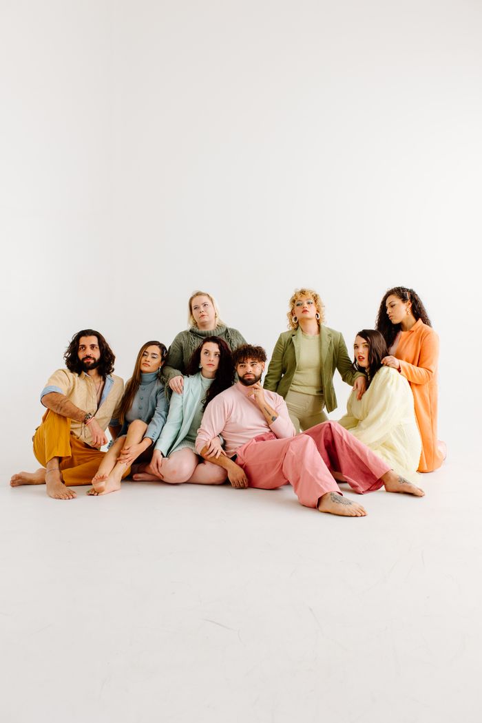 Group seated together in a plain studio — photo by Rose Groves on Pexels