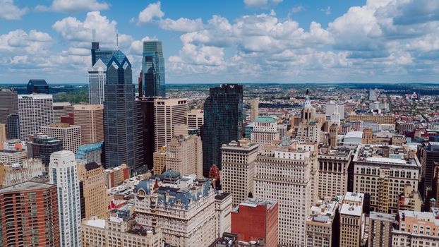 Stunning aerial view of Philadelphia's skyline highlighting modern skyscrapers under a vibrant blue sky.