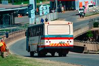 A bus navigating a busy street in Manzini, capturing urban life in Eswatini.