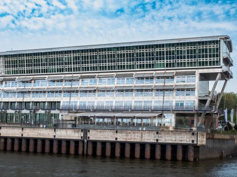 Contemporary waterfront building with sleek glass architecture and industrial design.