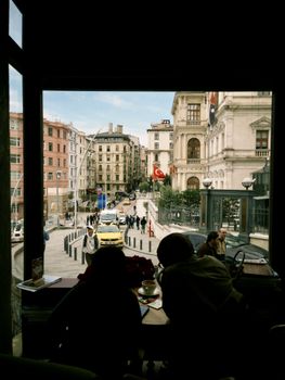 Captivating city street view from a cozy cafe window in Istanbul, showcasing the vibrant urban landscape.