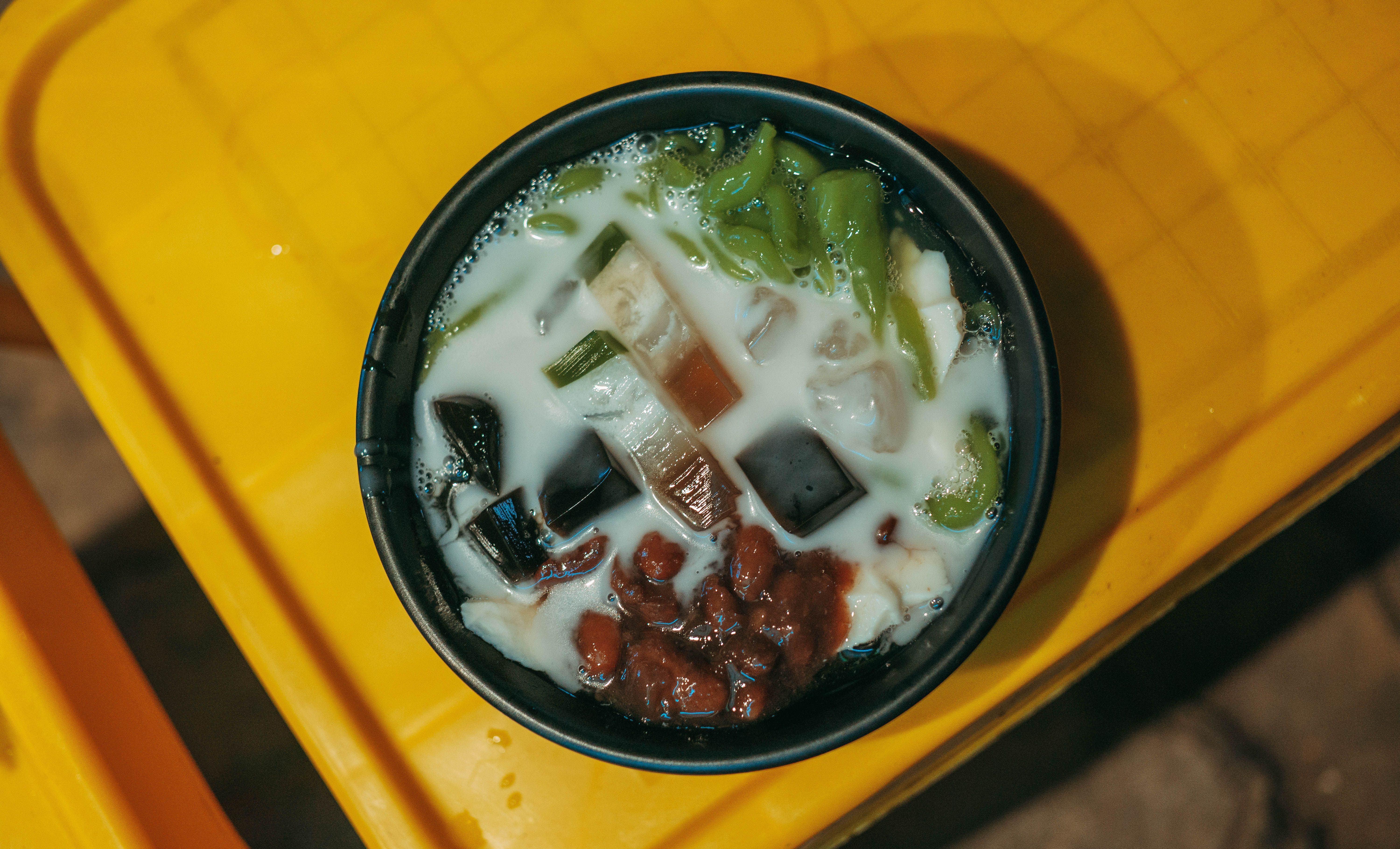 A colorful glass of Halo-Halo, a popular Filipino shaved ice dessert with various sweet ingredients