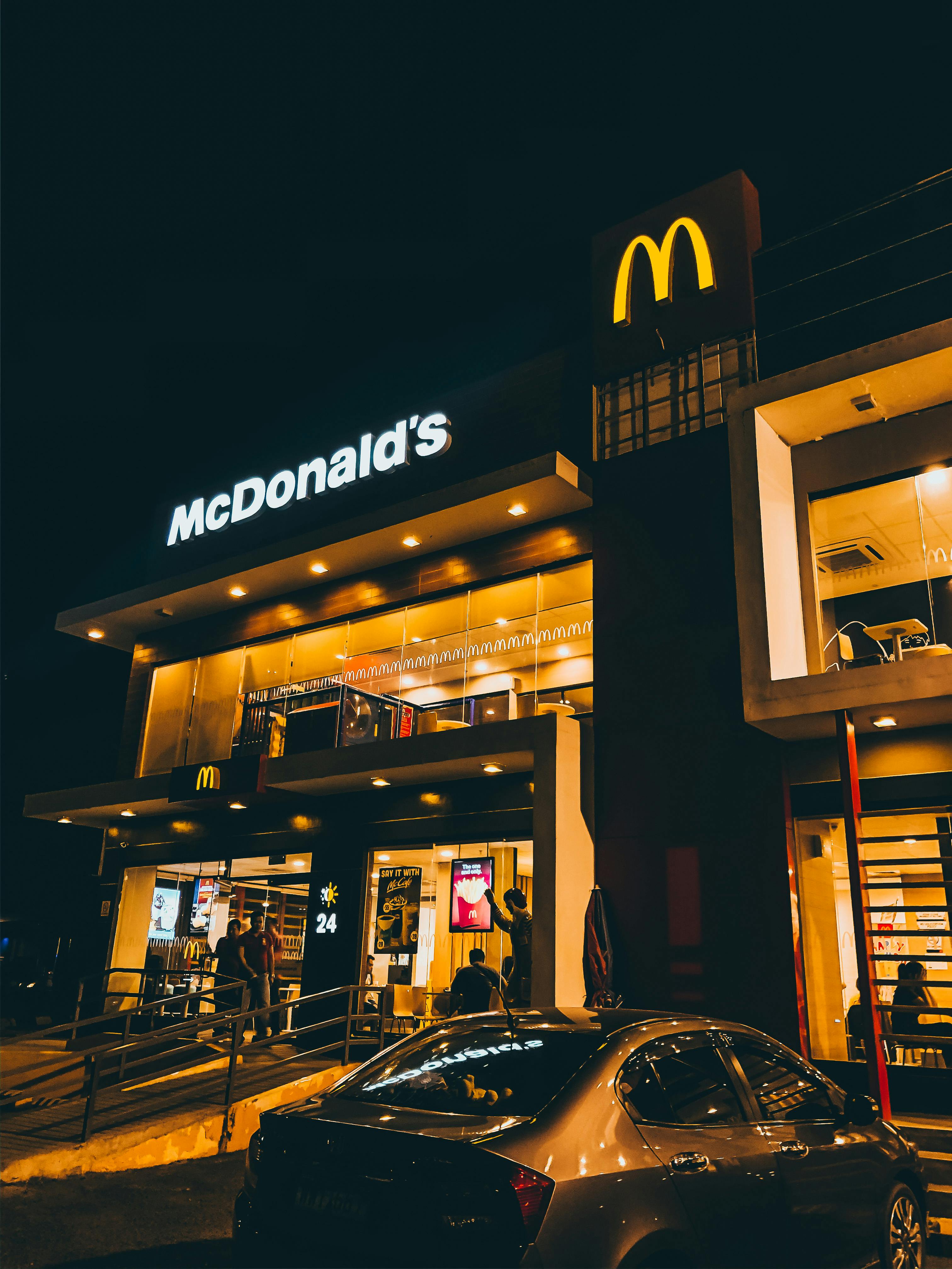 people standing near restaurant chain