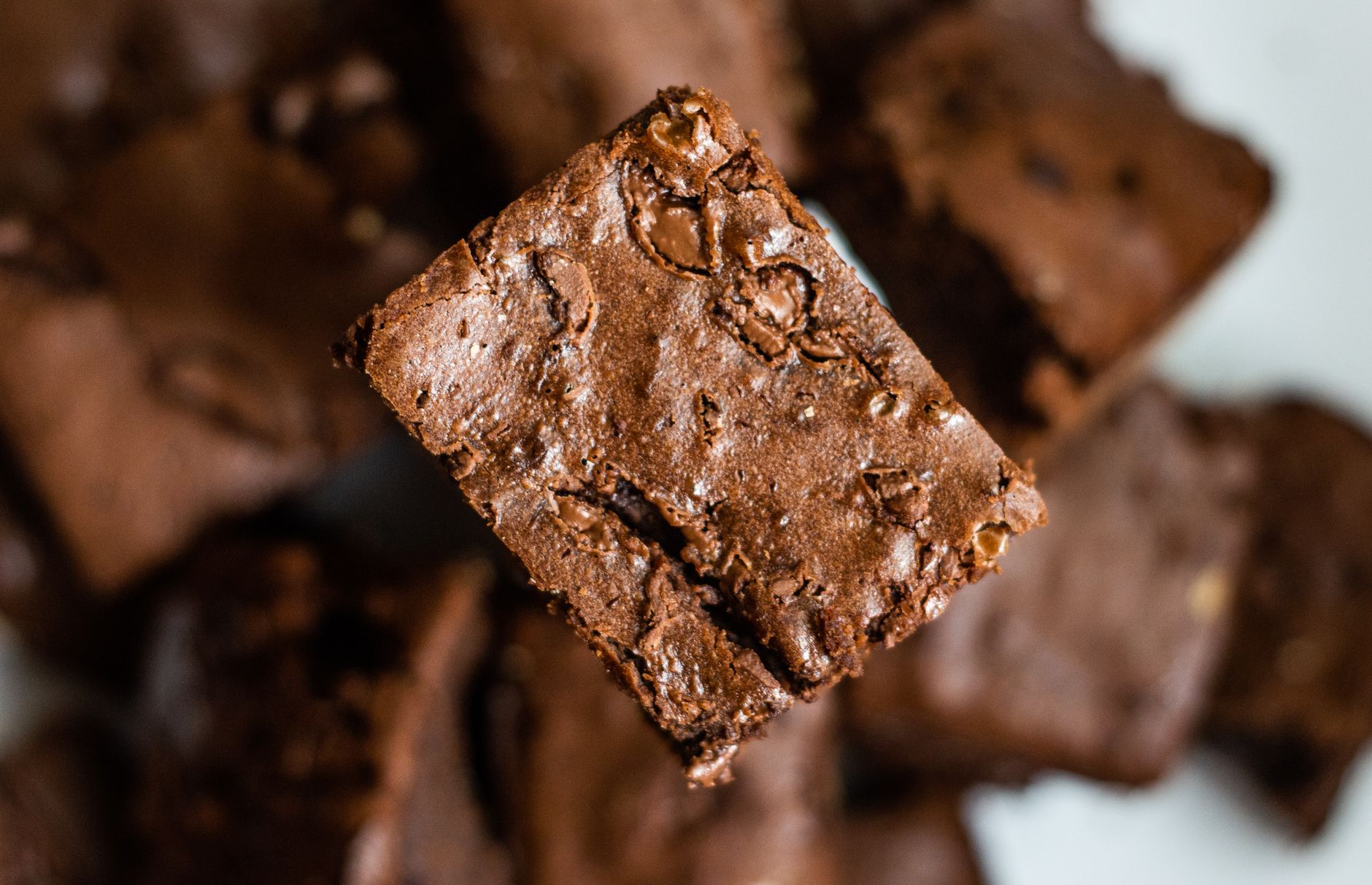 Appetizing close-up of a chocolate brownie, highlighting texture and details.