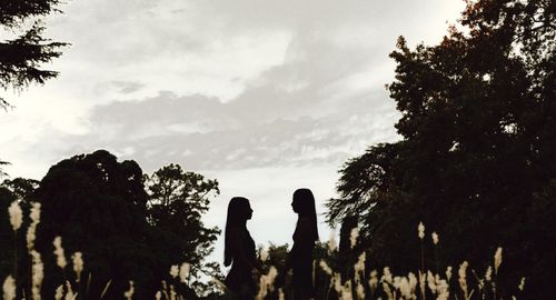 Free Silhouetted figures in a serene Argentinian landscape during sunset, capturing nature's beauty. Stock Photo
