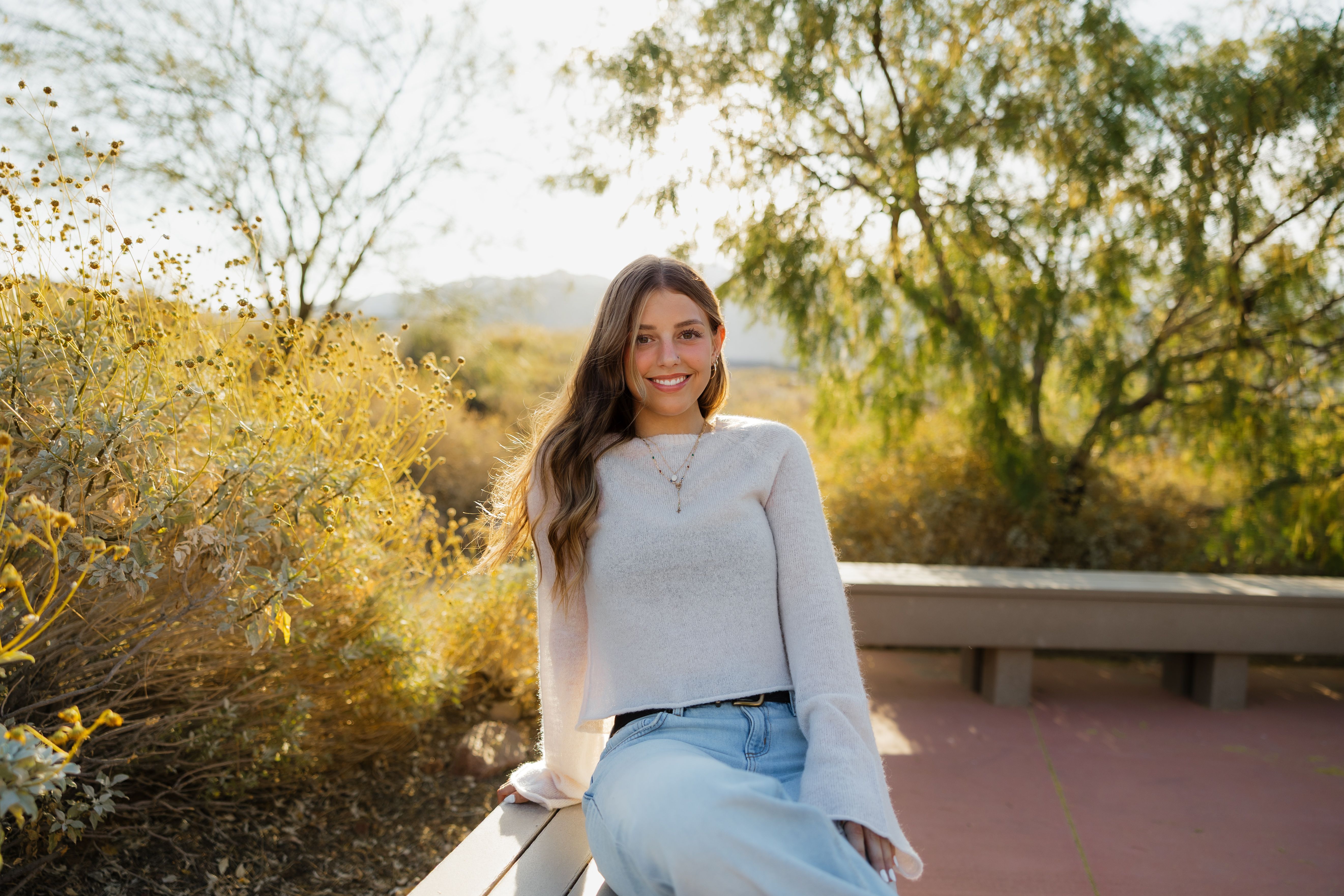 Smiling Woman Outdoor Portrait in Sunny Park · Free Stock Photo