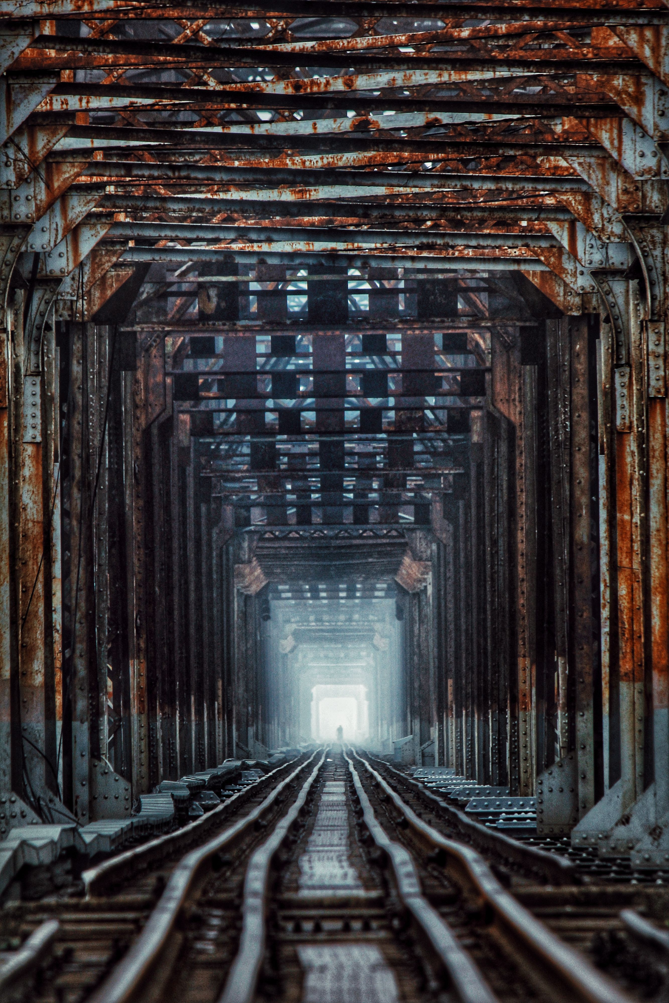 Rusty Railroad Bridge with Vanishing Point · Free Stock Photo