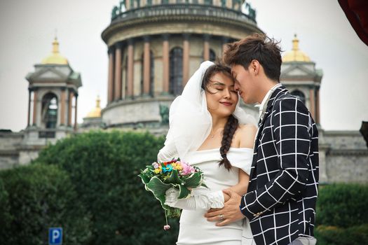 Man and Woman Holding Bouquet of Flowers
