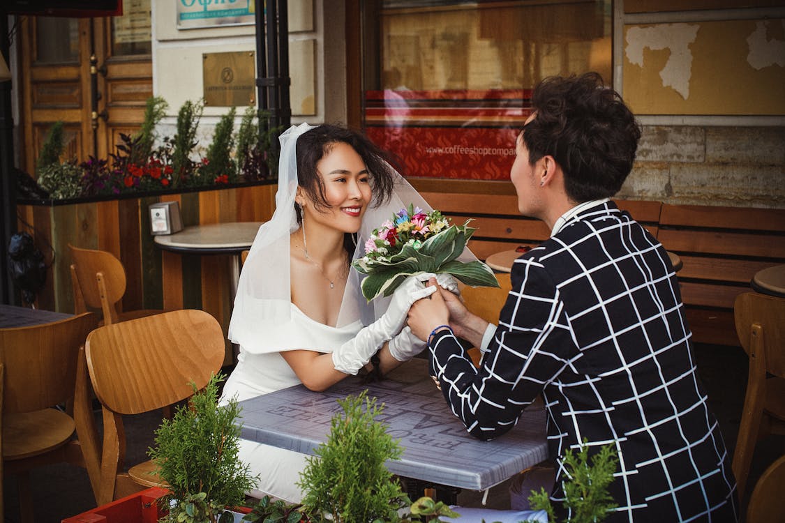 Free Man and Woman Sitting on Chair Stock Photo