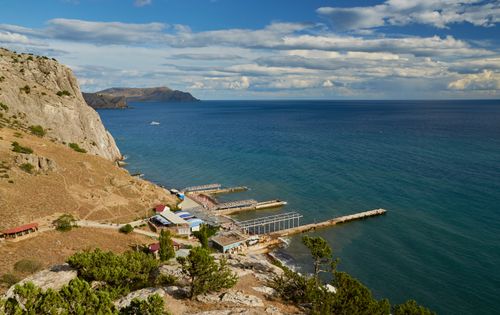 Free Picturesque view of Crimea coastline with rocky cliffs and blue sea, ideal for nature and travel themes. Stock Photo