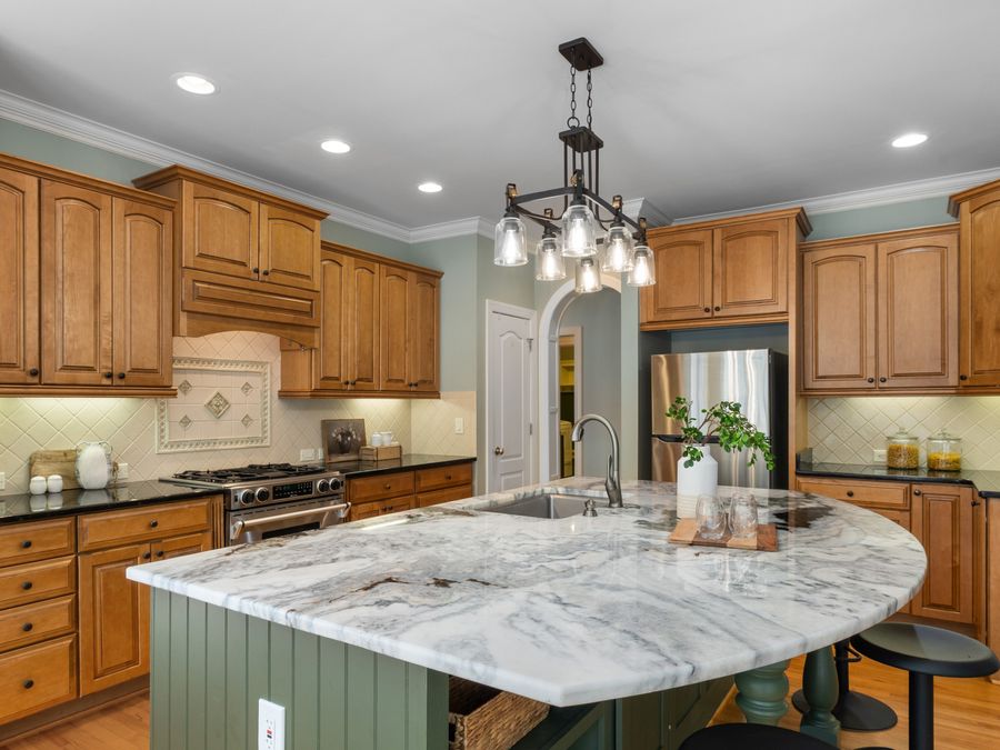 Interior with feature ceiling lighting above a kitchen island