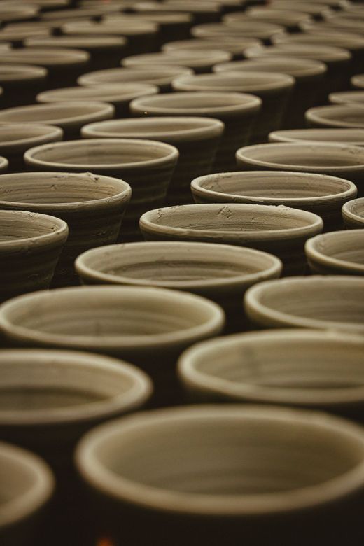 Handmade clay pots in a repeating pattern — Soumyojit Sinha on Pexels