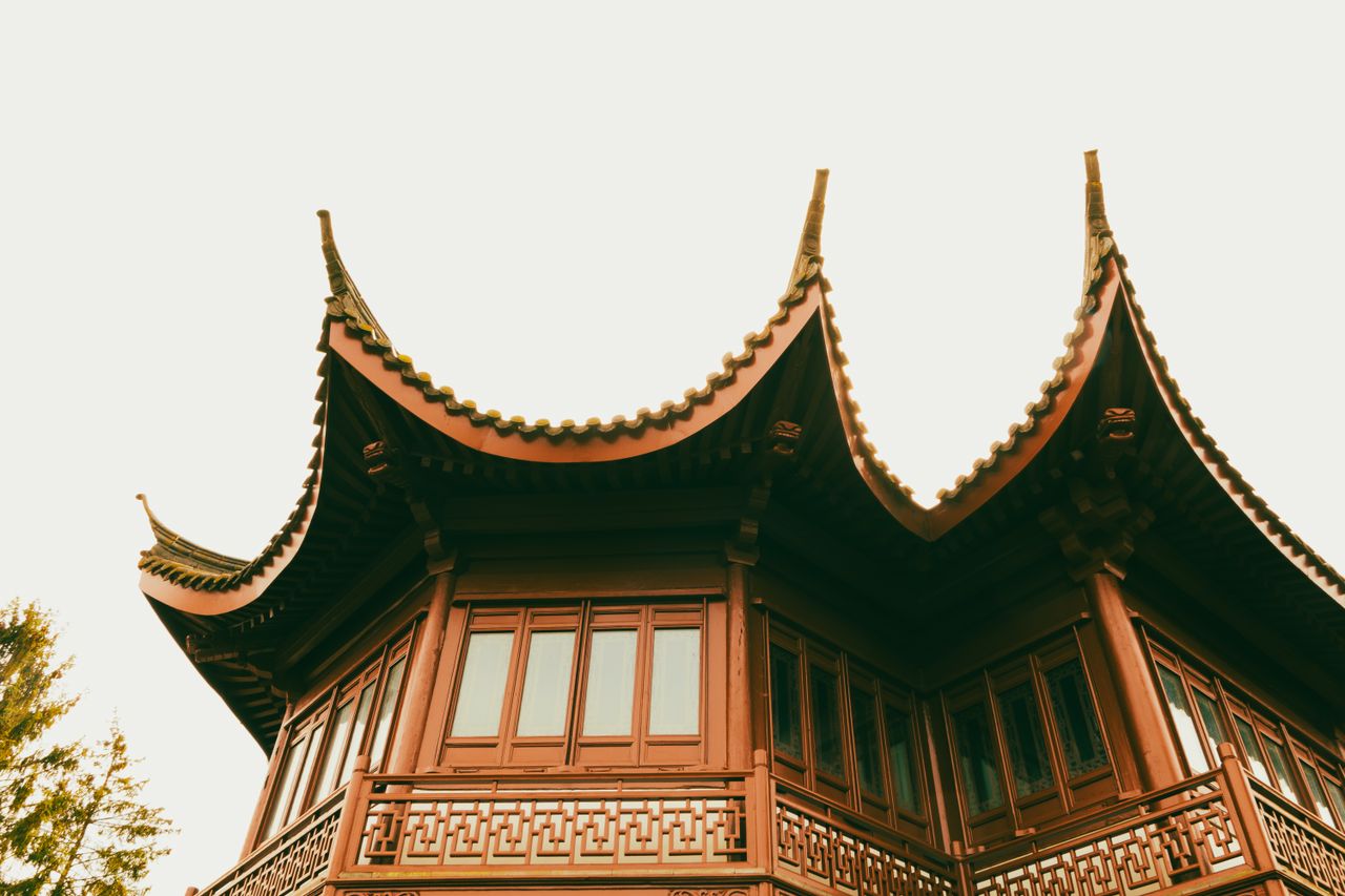 detailed view of a traditional chinese pagoda with intricate curved ro