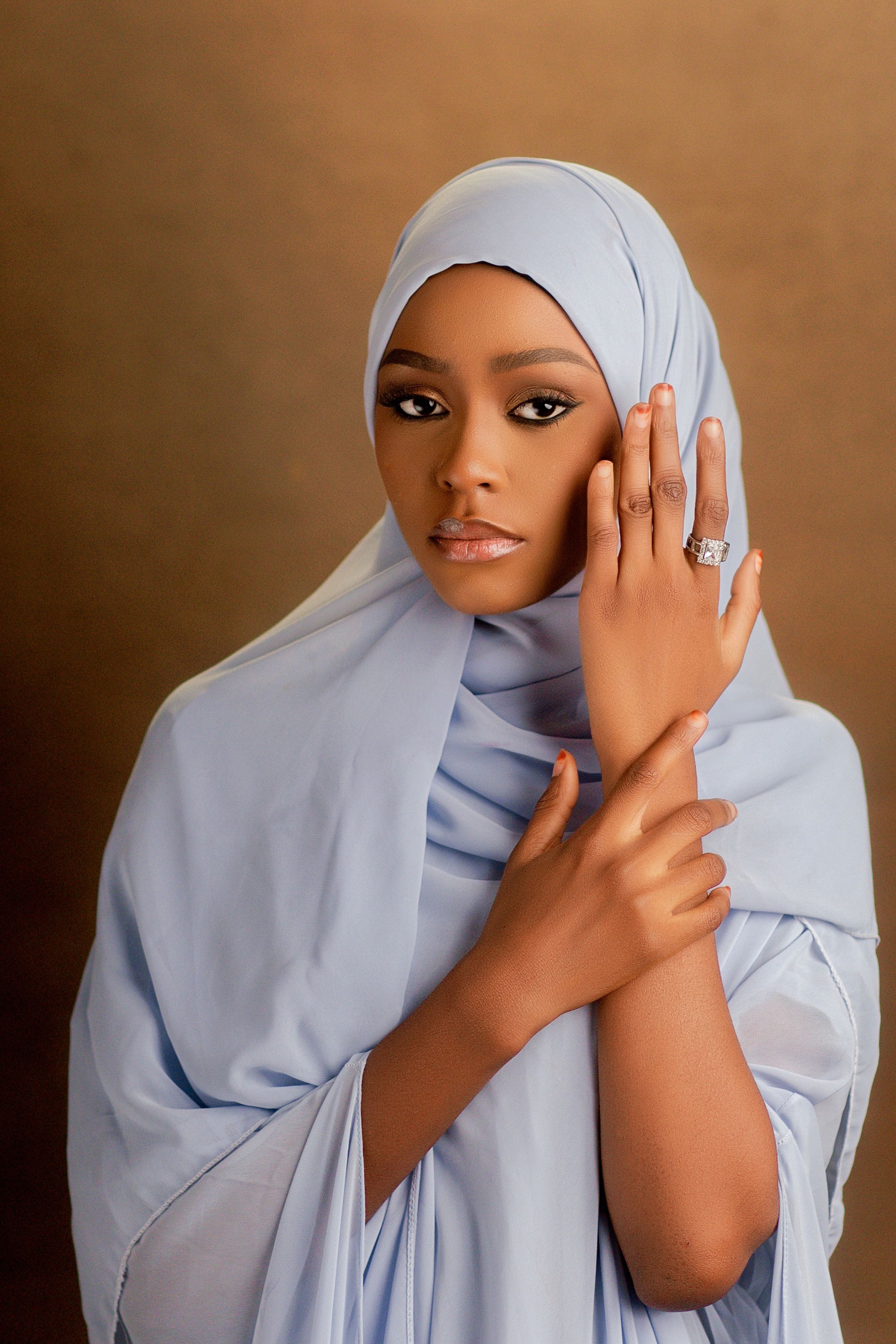 Elegant Portrait of Woman in Light Blue Hijab · Free Stock Photo