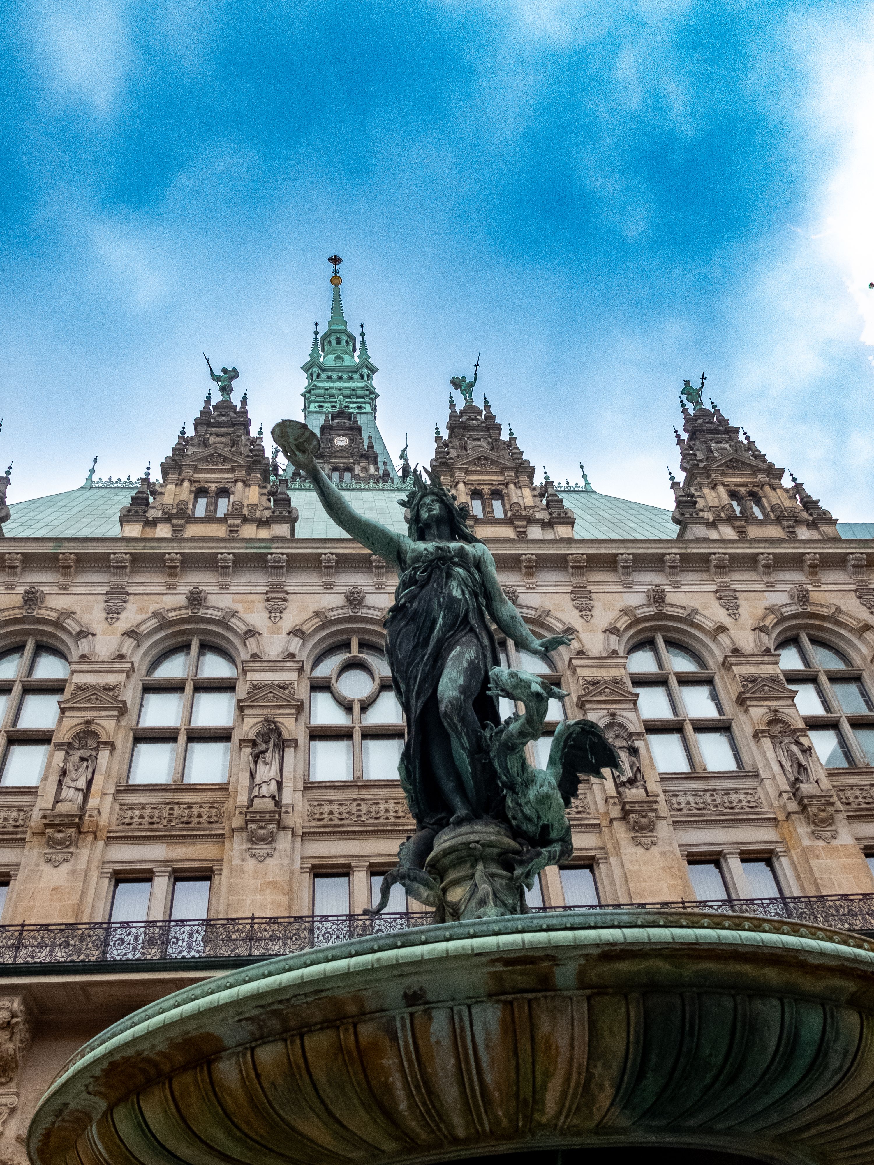 Free Statue and ornate building facade in Hamburg, Germany. Stock Photo