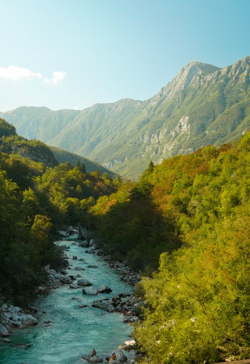 Free Breathtaking landscape of the Soča River and mountains in Slovenia under clear skies. Stock Photo