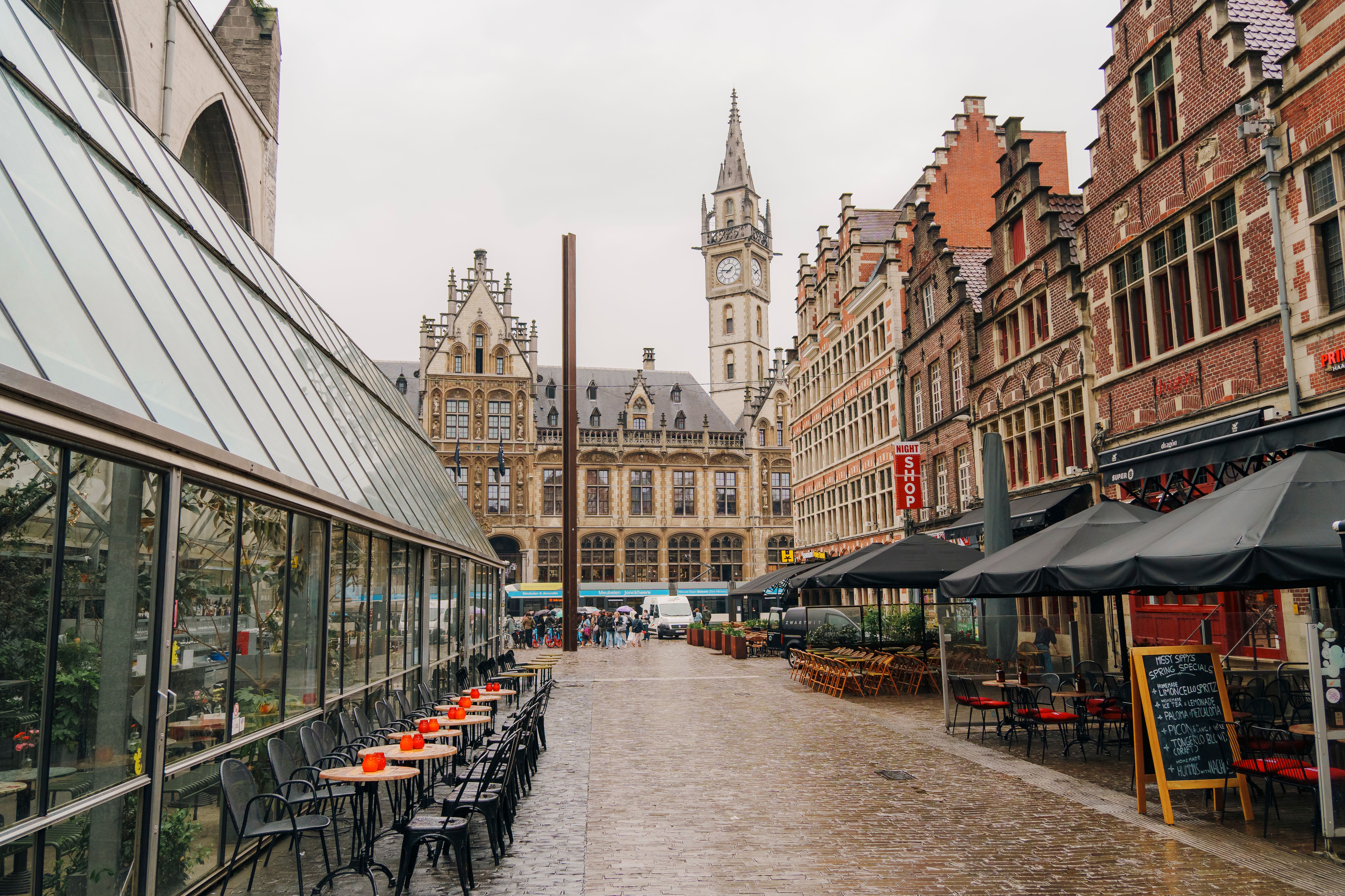 Explore a picturesque street in Ghent, Belgium, featuring iconic architecture and a lively atmosphere.