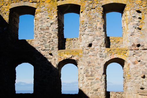Free Stone ruins with arches against a clear blue sky in Gränna, Sweden. Stock Photo